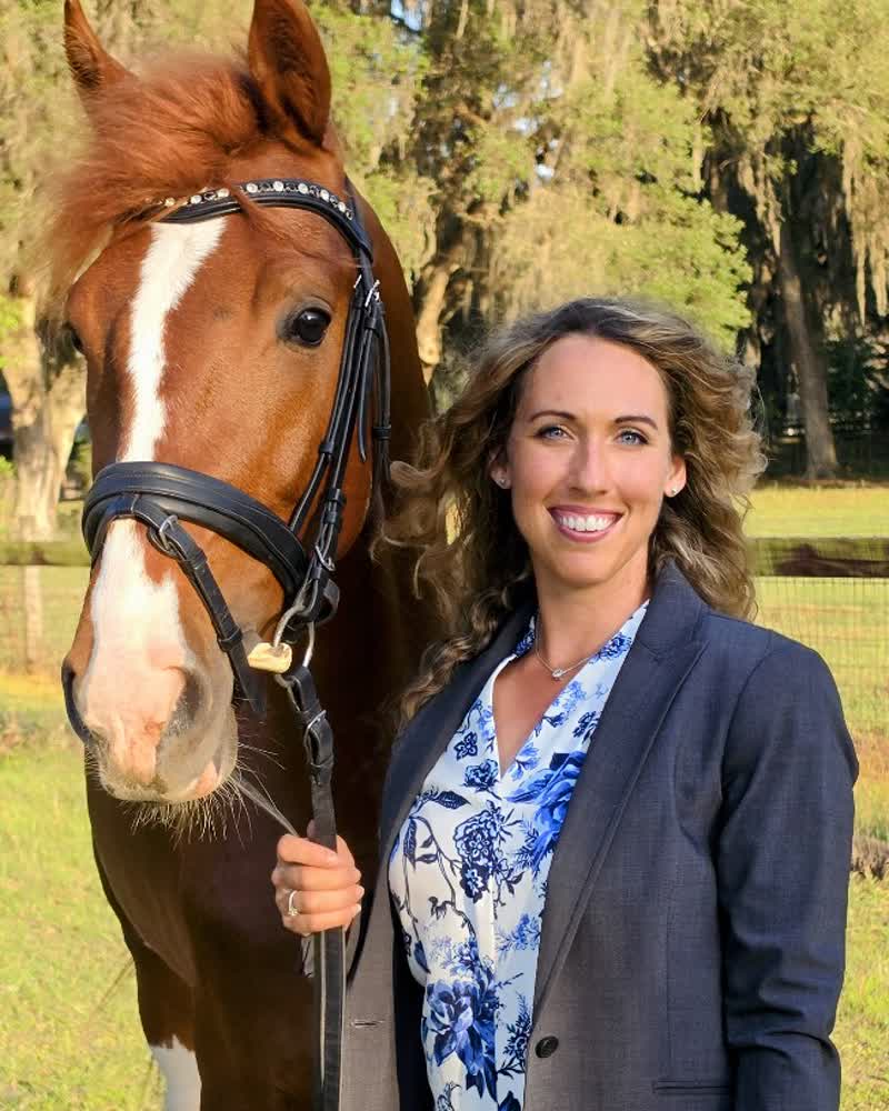 Kaitlin Snyder, Principal and Owner of EquiStaff, with a horse in Ocala, Florida